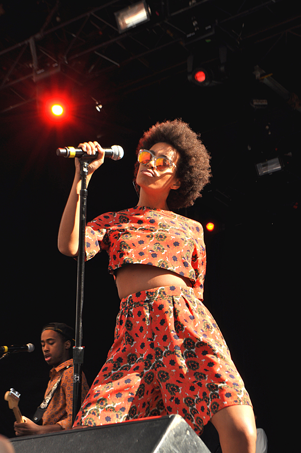 solange-knowles-boston-calling-festival-nasty-gal-le-specs-half-moon-magic-sunglasses-noon-by-noor-spring-2014-floral-print-crop-top-shorts-rebecca-minkoff-stella-wedges-1