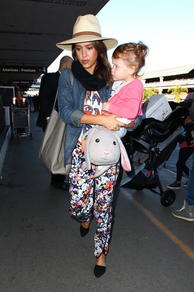 Jessica Alba and daughter Haven arrive at LAX in multi styled outfit