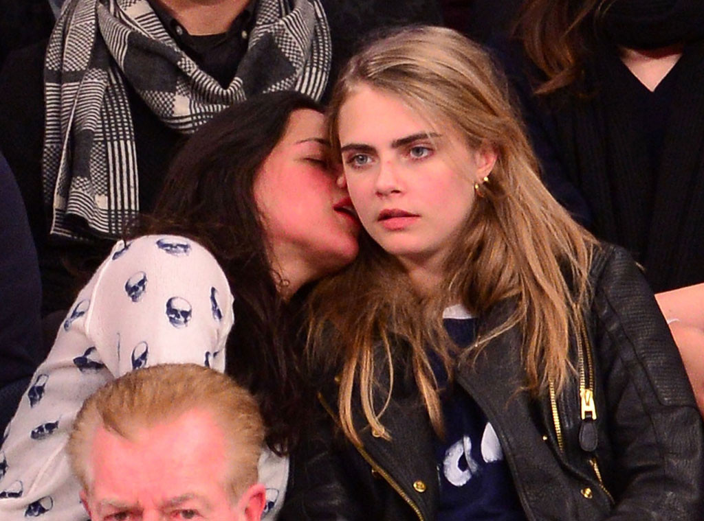 Michelle Rodriguez Gives Cara Delevingne a Sloppy Kiss at 