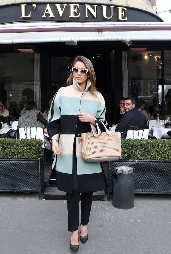 Jessica Alba look tres chic in Paris in a colorfully striped coat.