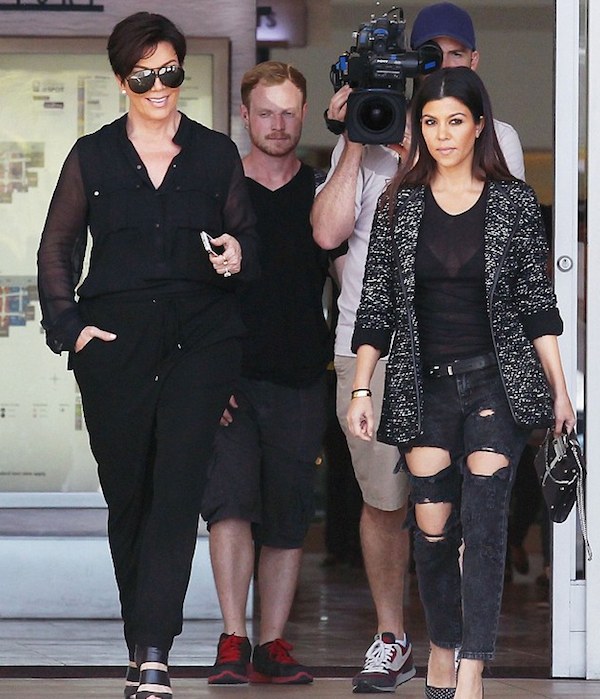 Kourtney Kardashian went for rocker chic in Calabasa in ripped jeans and a sheer shirt.