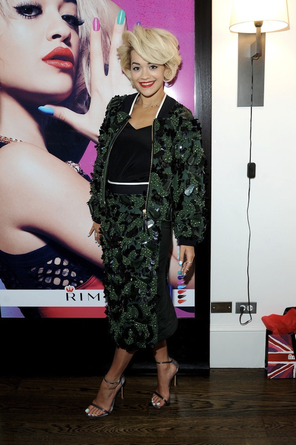 Rita Ora wears a MARNI black and green skirt and jacket with tri-dimensional embroidered hand-cut stones from the Spring:Summer 2014 collection while attending the Rimmel London press preview at The Mercer Hotel