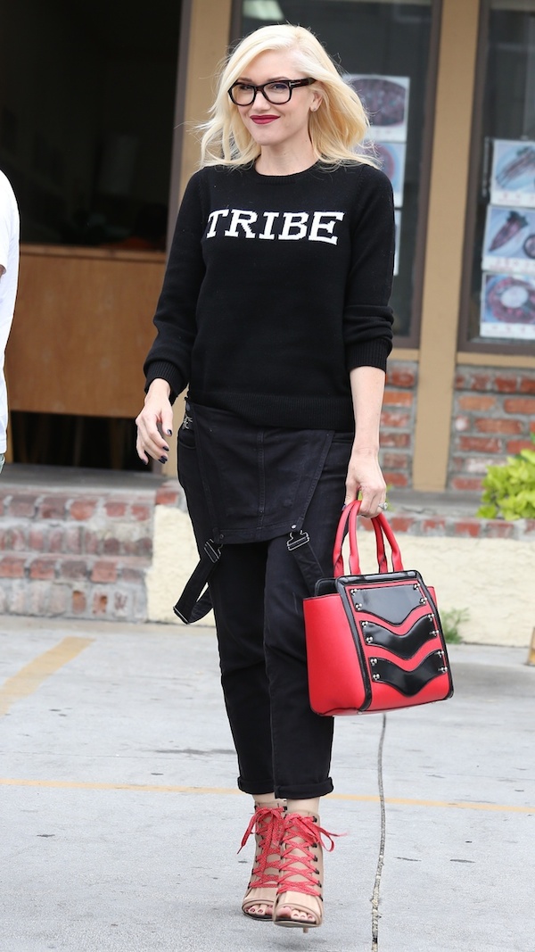 Gwen Stefani sports a black Tribe sweater, red bag and red heels as she stops by an acupuncture center in Koreatown