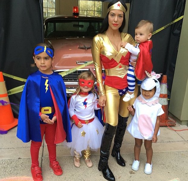 Kourtney Kardashian showed off her frame in a Wonder Woman ensemble, along with her childen Penelope, Mason, and Reign, and niece North West.