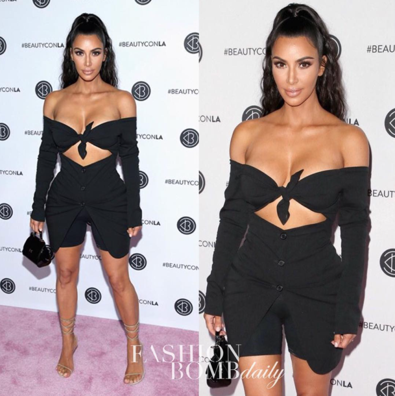 Kim Kardashian shows off her tiny waist in a classic pink and black cropped  jacket by Chanel 