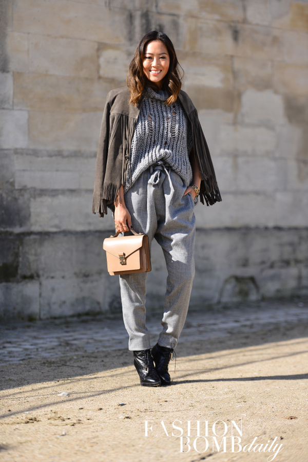 Power Blogger Aimee Song of Song of Style pair chunky knits with a fringed suede jacket. Image by David Nyanzi