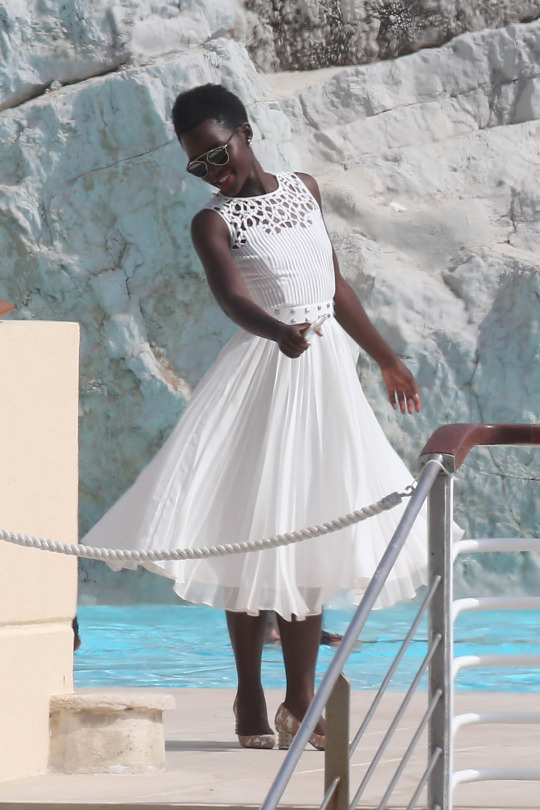 lupita nyongo cannes day 2 dior white pleated dress