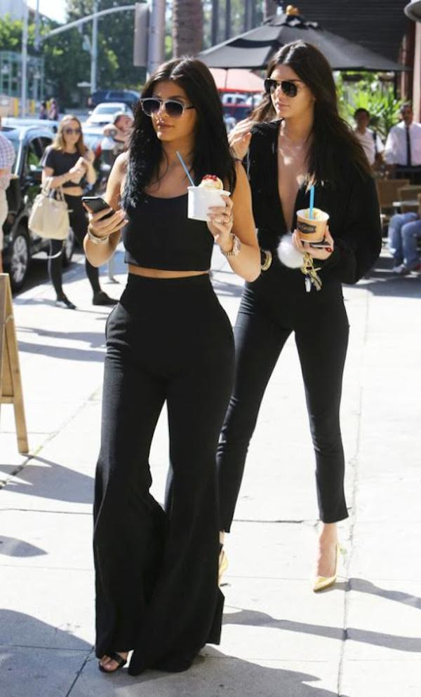 Kylie Jenner kept it cute in a Tamara Mellon crop top and pants while Kendall Jenner donned a black Esosa top and while out and about in L.A. Cute!