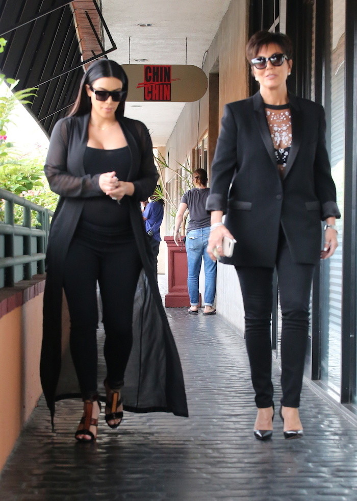 Pregnant Kim Kardashian and mother Kris Jenner match in black outfits as they enjoy lunch in Los Angeles