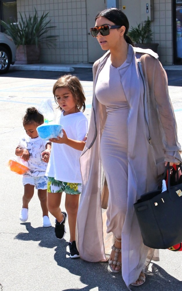 Pregnant Kim Kardashian heads to a birthday party with daughter North and niece Penelope Disick