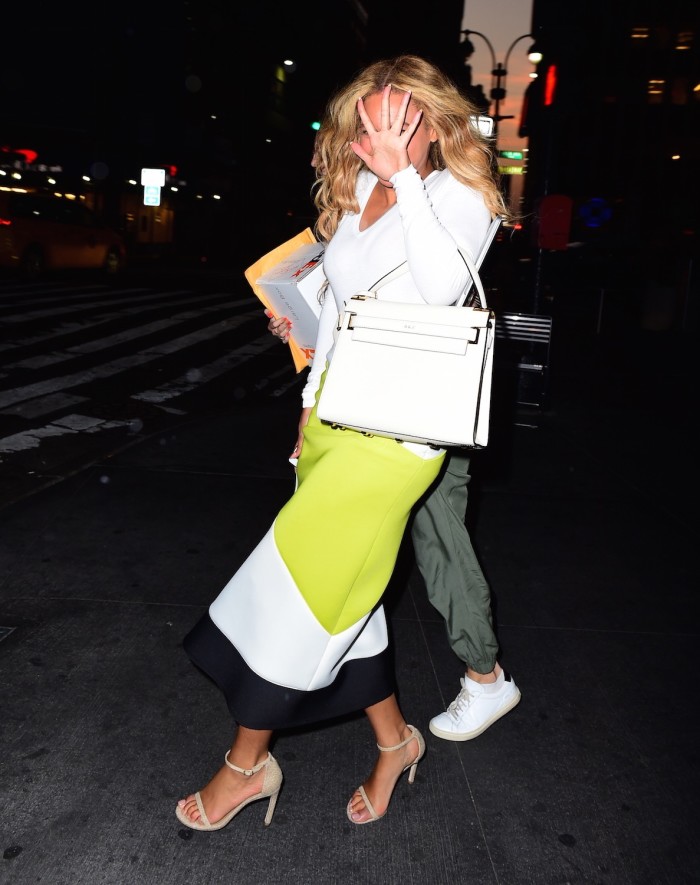 7 Beyonce's New York City High Slit Colorblock Pencil Skirt, Stuart Weitzman Nudist Sandals, and Valentino My Rockstud White Top Handle Bag