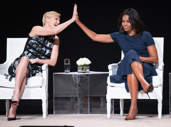 Charlize Theron and First Lady Michelle Obama gave high fives at the Let Girls Learn Global Conversation at NYC's Apollo Theater. Lovely!