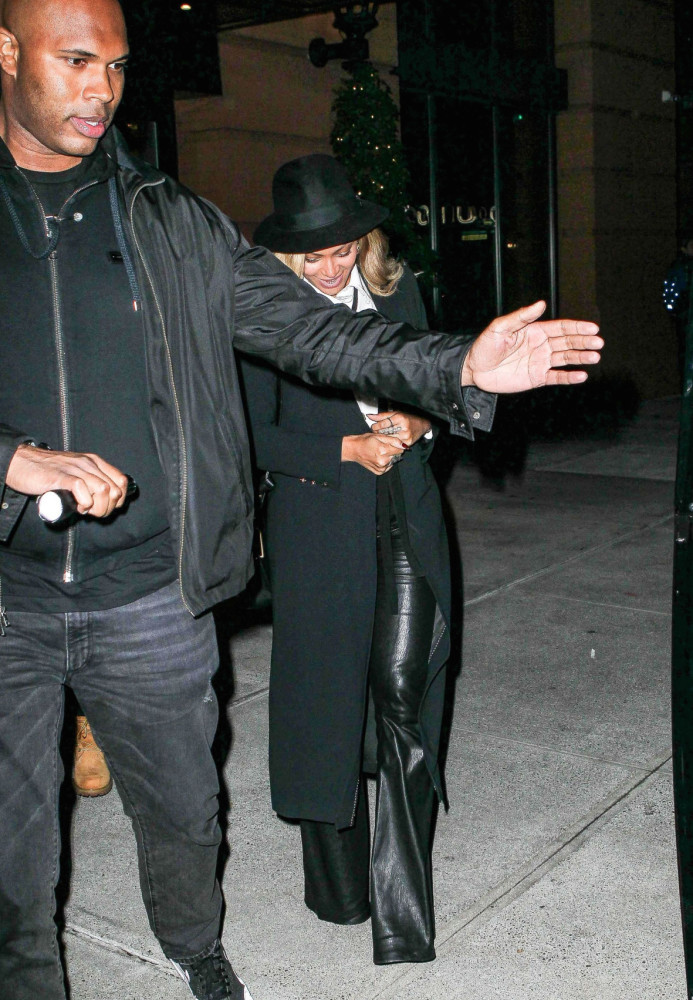 2 Beyonce's New York City Dinner Alice + Olivia Janis White Button Down with Neck Tie, Black Leather Bell Pants, and Talia Pleated Back Long Coat