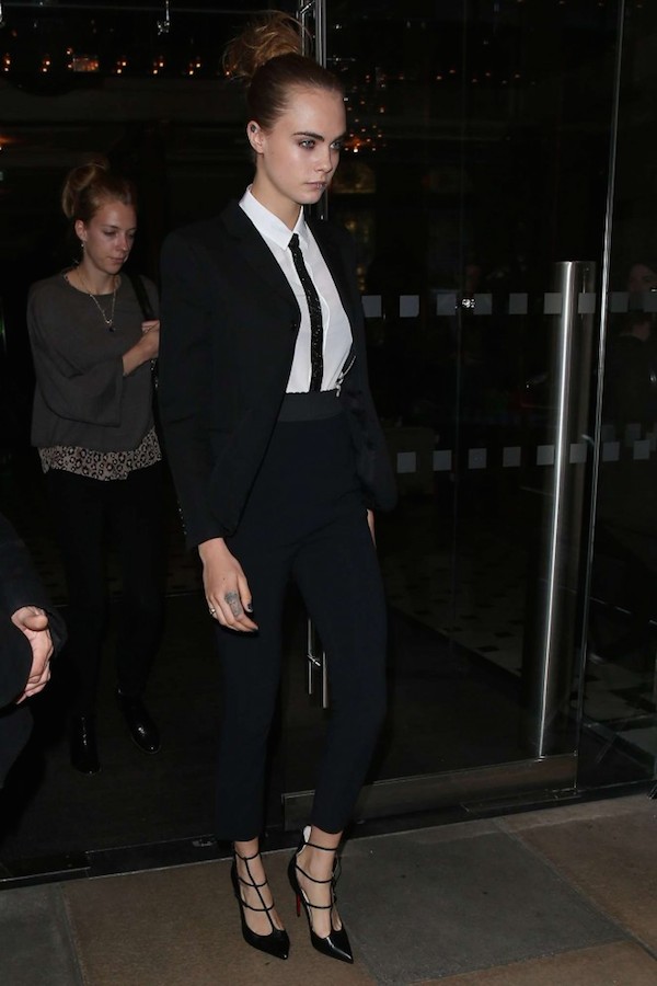 Cara Delevingne donned a chic suit and strappy pumps while in