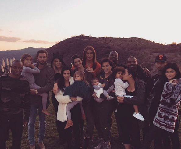 The Kardashian and Jenner family posted a family photo, with babies and boyfriends in tow.