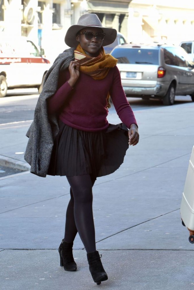 lupita-nuong-o-in-mini-pleated-dress-and-purple-top-at-public-theater-in-nyc-november-2015