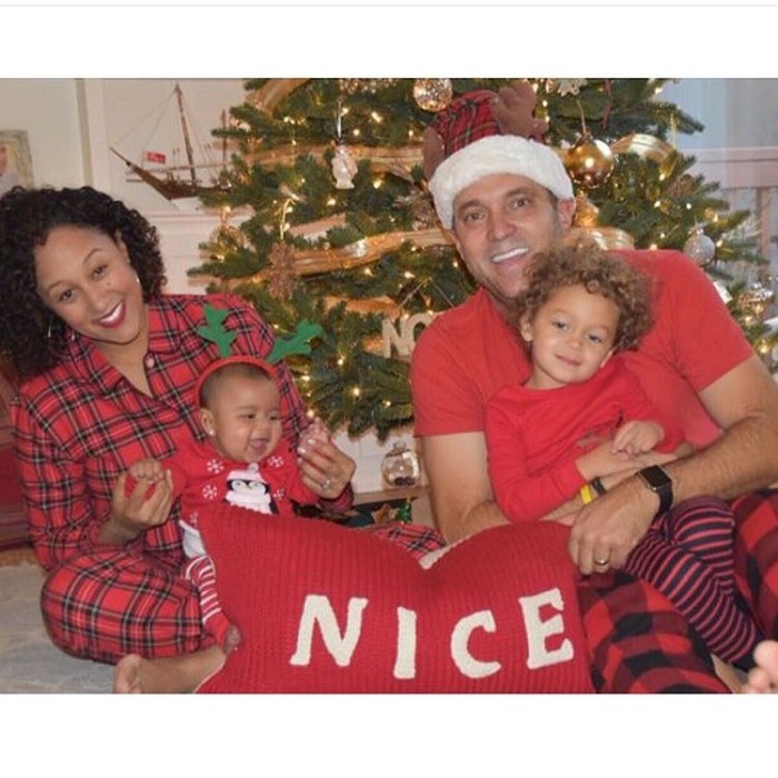 Tamera Mowry and Adam Housley posed with their adorable kids for their holiday card.