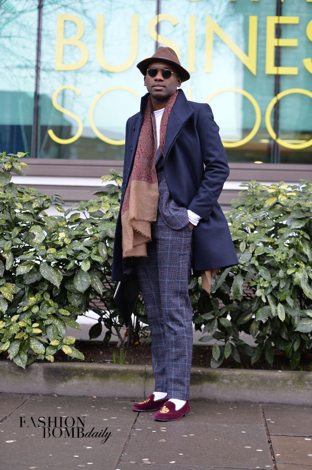 A plaid suit was accented by burgundy velvet slippers and a navy coat. Image by David Nyanzi.