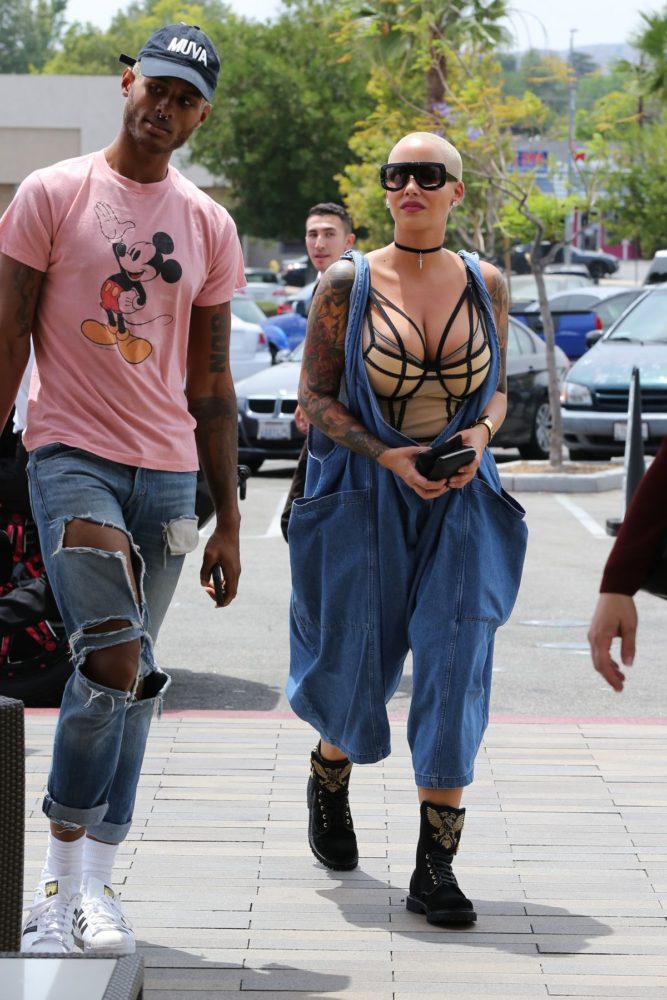 amber-rose-at-cheesecake-factory-69-crossover-oversized-linen-overalls-balmain-eagle-ranger-embroidered-suede-boots-2