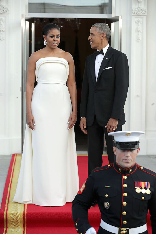 First Lady Michelle Obama wears a Custom Brandon Maxwell Strapless Ivory Sponge Crepe Gown to the White House State Dinner