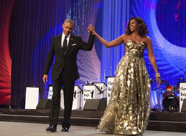 First Lady Michelle Obama Wears Naeem Khan Gold Strapless Gown to the Phoenix Awards Dinner