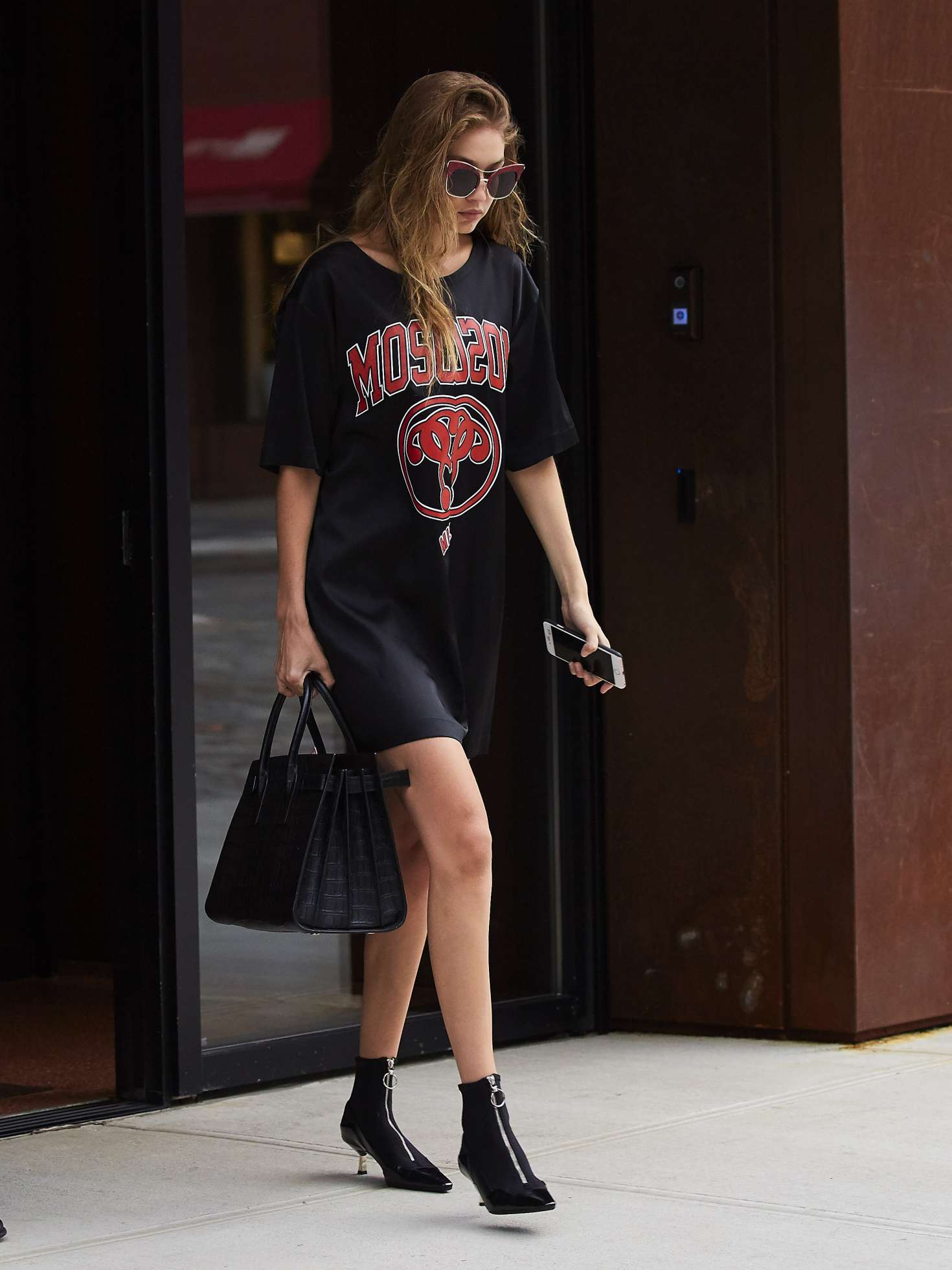 Versace - Gigi Hadid rocks the perfect street style in her #Versace  loungewear and her black #VersacePalazzoEmpire bag. #VersaceCelebrities