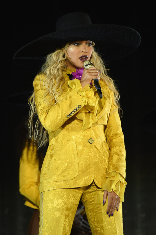 8-3-beyonce-closes-out-her-formation-world-tour-in-a-robert-cavalli-fall-2016-mustard-yellow-suit-a-gilles-montezin-balloon-sleeved-oversized-coat-and-lust-for-life-usa-blue-velvet-boots-and-more