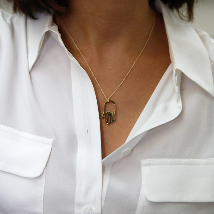 rashida-jones-14k-yellow-gold-vermeil-and-black-diamond-hamsa-hand-pendant-necklace-model-lifestyle-street-style