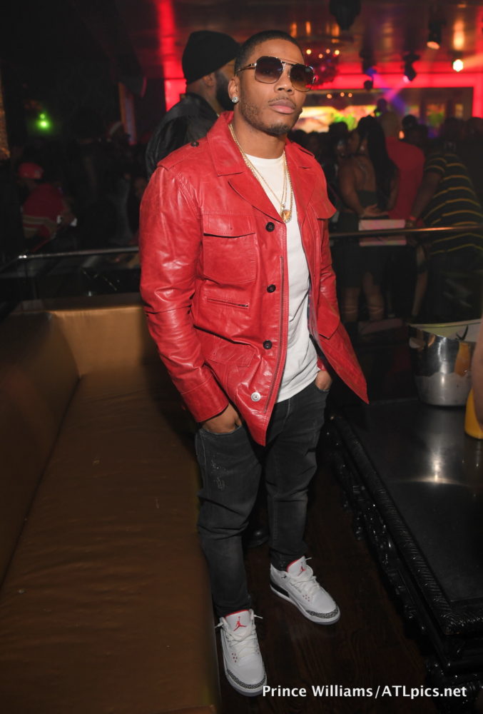 nelly-kenny-burnss-nelly-compound-valentino-star-motif-olive-green-jacket-balmain-jeans-and-nike-sf-utility-air-force-1s