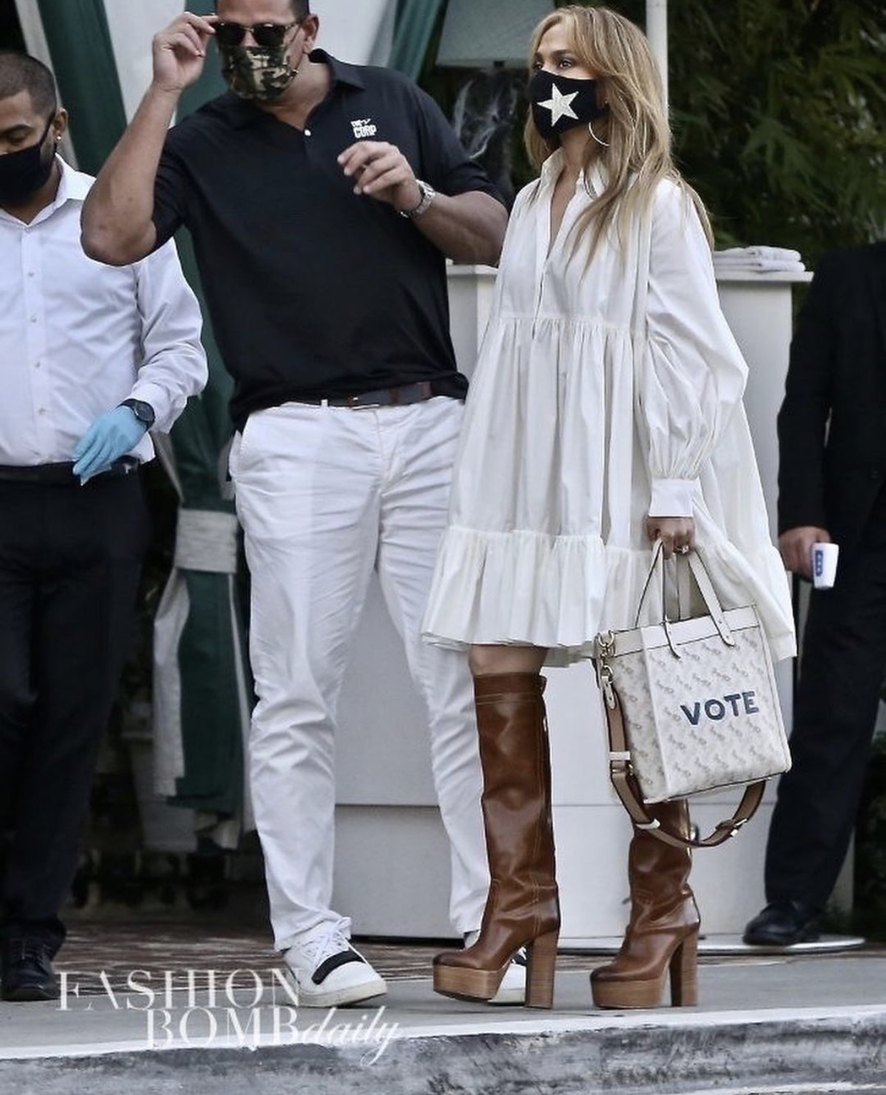 Jennifer Lopez Spotted In White Valentino Puff-Sleeve Tiered Shirt Dress  Paired with Coach Custom 'Vote' Field Tote and Brown Pre-Fall 1941 Platform  'Turbo' Boots
