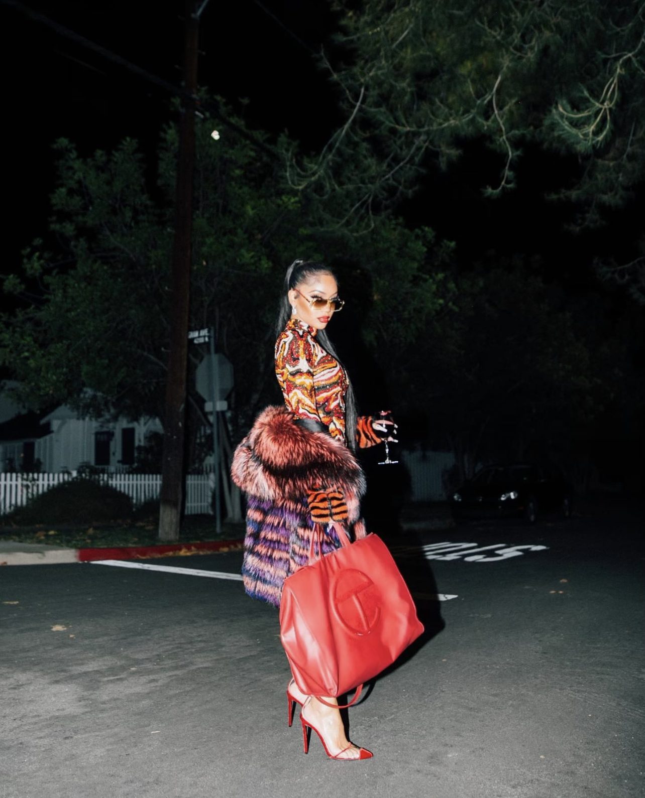 Saweetie Brought In the New Year in Elie Madi Multicolor Leopard Print Dress Red Large Telfar Bag for Stars Fashion House Fur Coat Natalie Mills Earrings and Red ALEVi Milano Shoe