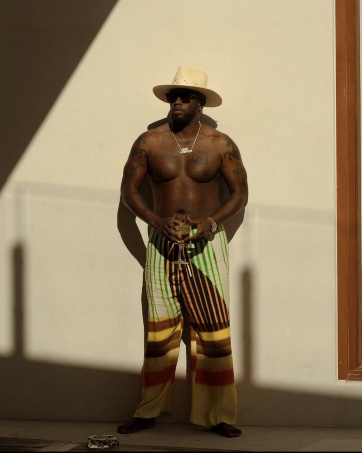 Wardrobe Inquiry Diddy Spotted Vacationing in the Bahamas Wearing Dries Van Noten Multicolor Striped Pants