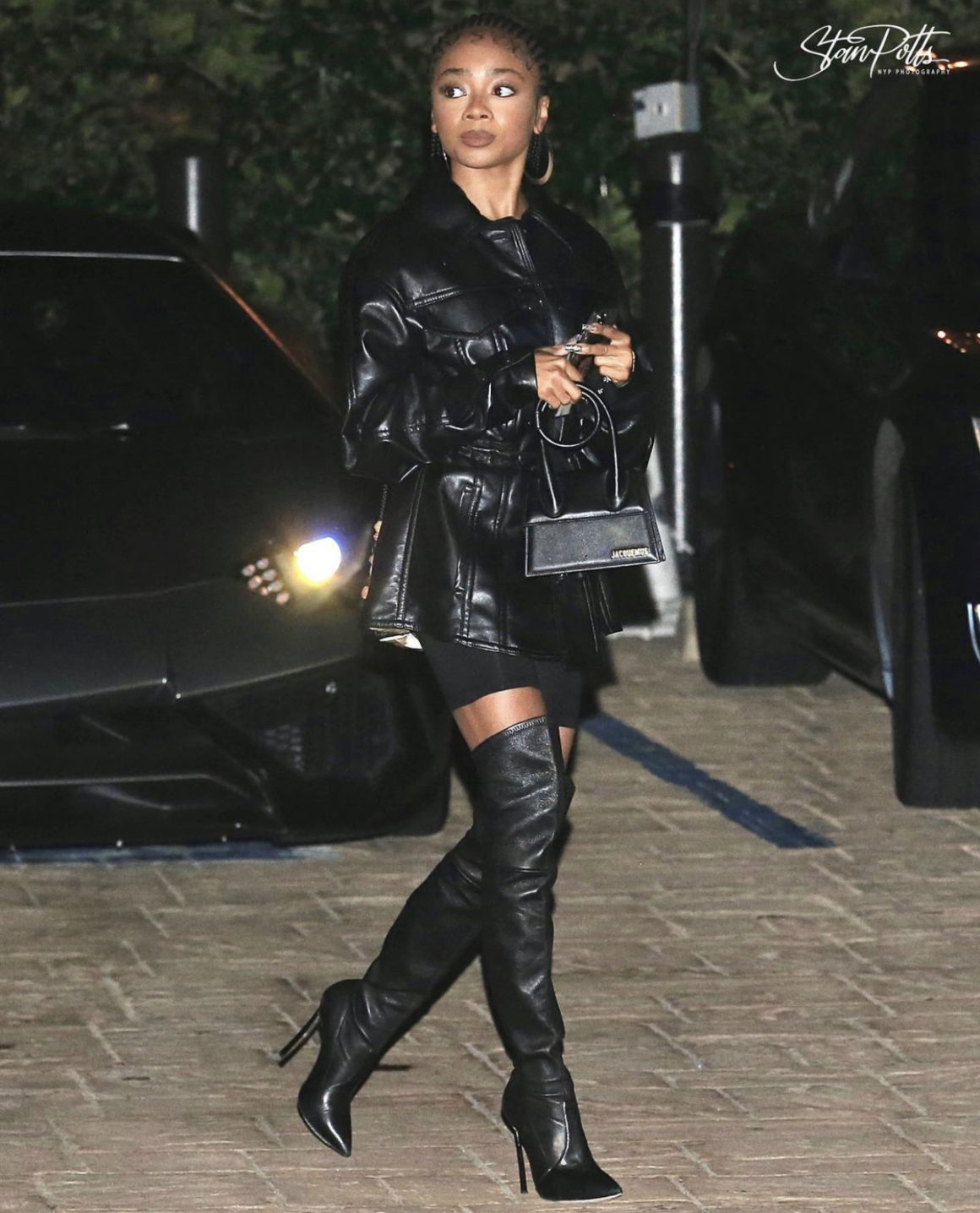 Skai Jackson Celebrates Her Birthday at NOBU Wearing Nanushka Black Leather Dress Casadei Bronze and Black Leather Thigh High Boots and Jacquemus Black Mini Bag 3