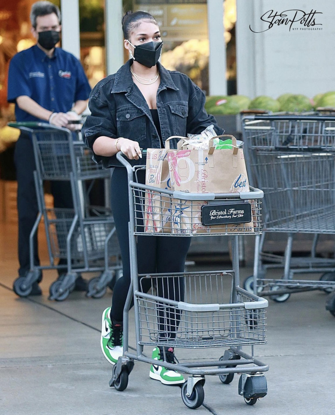 Lori Harvey Goes for a Grocery Store Run Wearing Alexander Wang Black Crop Denim Jacket Black Crop Top and Leggings