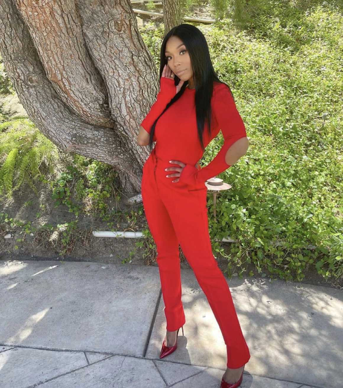 Brandy Gives Us a Style Moment in Givenchy Red Spring 2021 Look Including  Open-Back Elbow Cutout Long Sleeve Bodysuit and Skinny Leg Pants