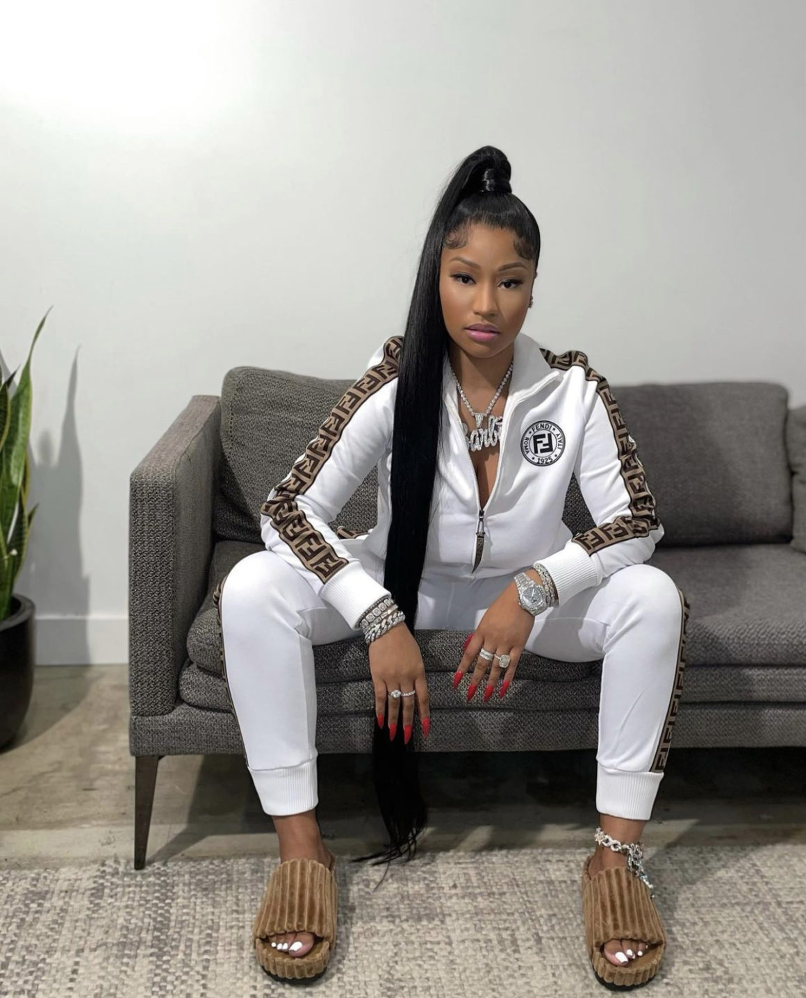 Nicki Minaj Holds Her Baby Boy Wearing Fendi Brown Logo Side-Stripe Track  Jacket and Pants While 'Papa Bear' Looked Adorable in a Burberry Logo  Onesie Set and Yeezy 380 Sneakers