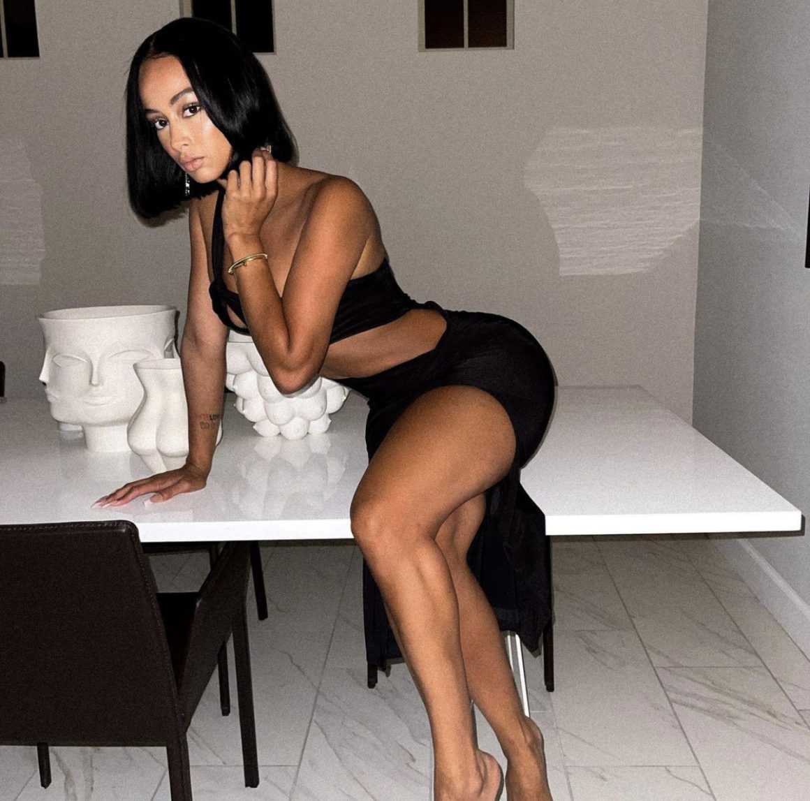 Draya Michele Delivers a Style Moment in Fashion Nova Black One Shoulder Cutout Dress