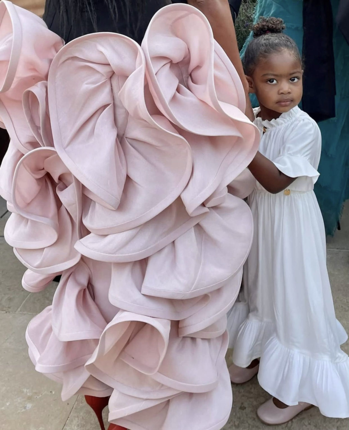 Kaavia James Shows Us Shes a Fashionista in the Making Wearing Lanvin White Ruffled Dress and Pink Ballet Flats at Parents Gabrielle Union and Dwyane Wades Anniversary Celebration in Paris3
