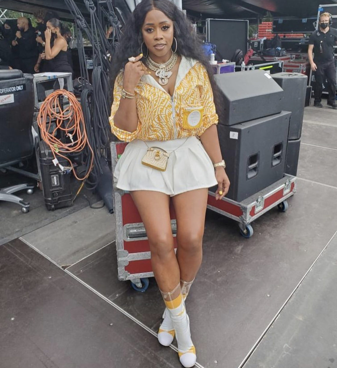 Remy Ma Performs at 'We Love NYC' Concert Wearing Fendi Yellow and White  Logo Jacket, Purse, and Socks Paired With Ms. Bling Pleated White Mini  Skirt and Chanel PVC Boots