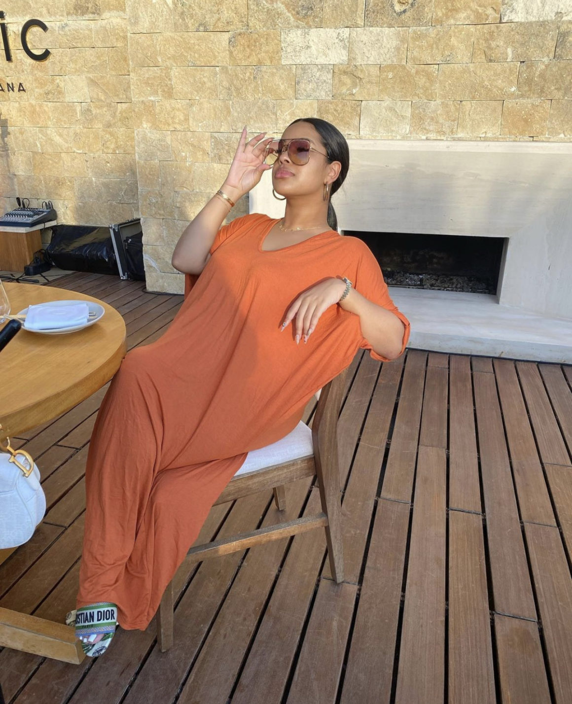 Taina Williams Catches Some Rays Wearing Fashion Nova Orange V-Neck Maxi Dress