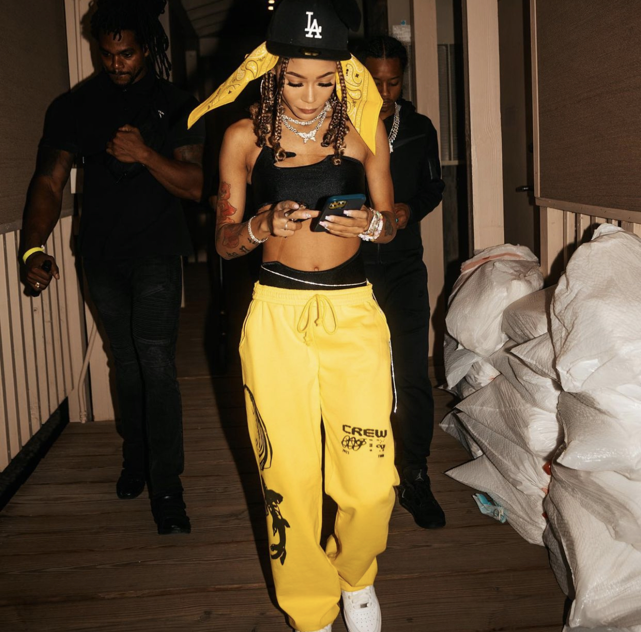 https://fashionbombdaily.com/wp-content/uploads/2021/09/Coi-Leray-Performs-in-Yellow-and-Black-Look-Featuring-Fashion-Nova-Black-Cutout-Bodysuit.jpg