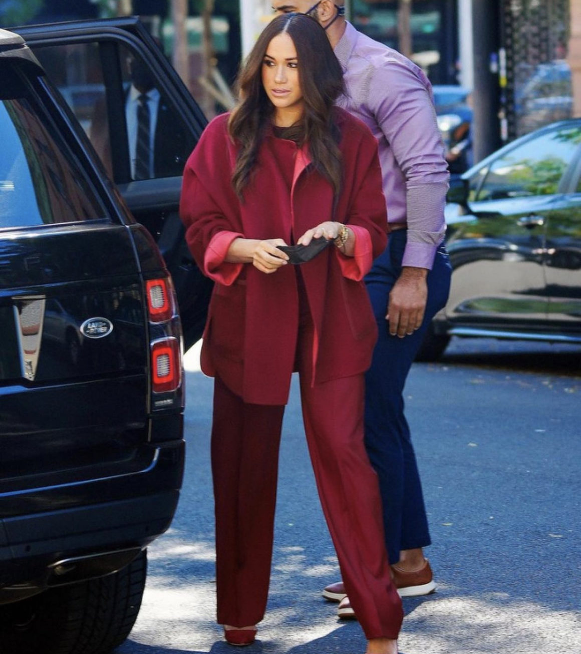Meghan Markle Visits School and Donates to Local Restaurant in New York  City Wearing Loro Piana Red Cashmere Cape and Wide Leg Pants – Fashion Bomb  Daily