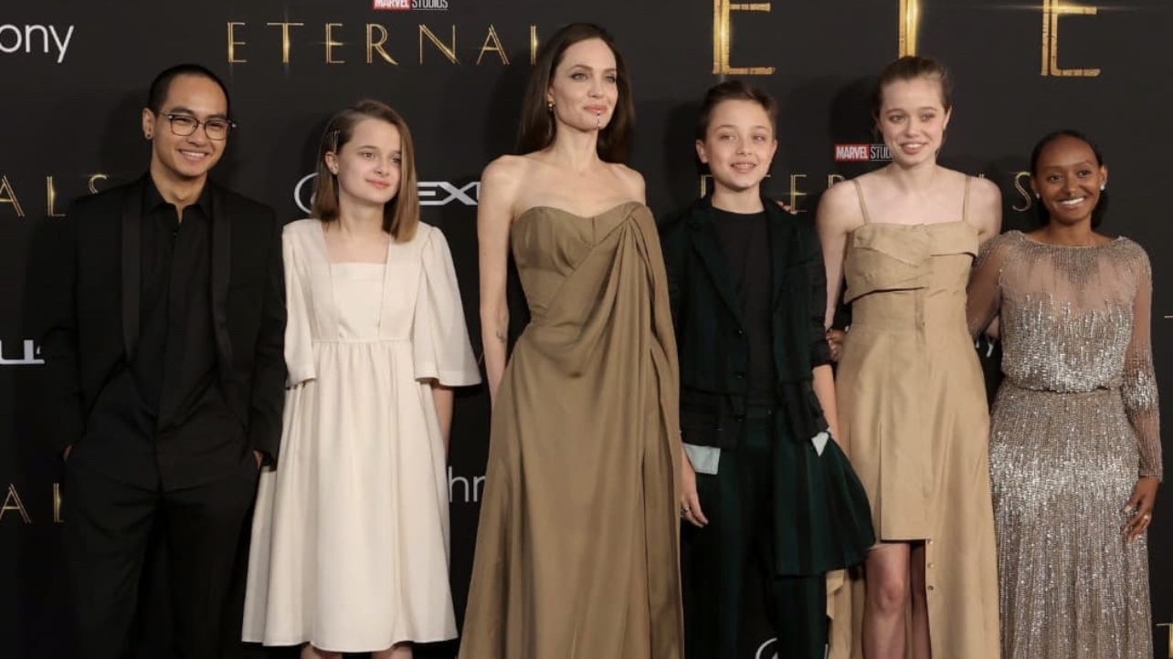 Angelina Jolie Attends LA Premiere of 'Eternals' With Her Kids, Wearing  Balmain Resort 2022 Brown Draped Corset and Pants Look + Zahara Jolie-Pitt  Rocks Mom's 2014 Oscars Dress by Elie Saab –