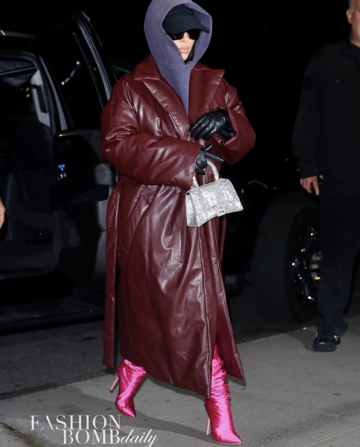 knude Nebu Original Kim Kardashian Bundles Up in Balenciaga Brown Padded Leather Coat, Purple  Hoodie, and Crystal Handbag Paired With Vetements x Manolo Blahnik Pink  Satin Thigh-High Boots While in NYC