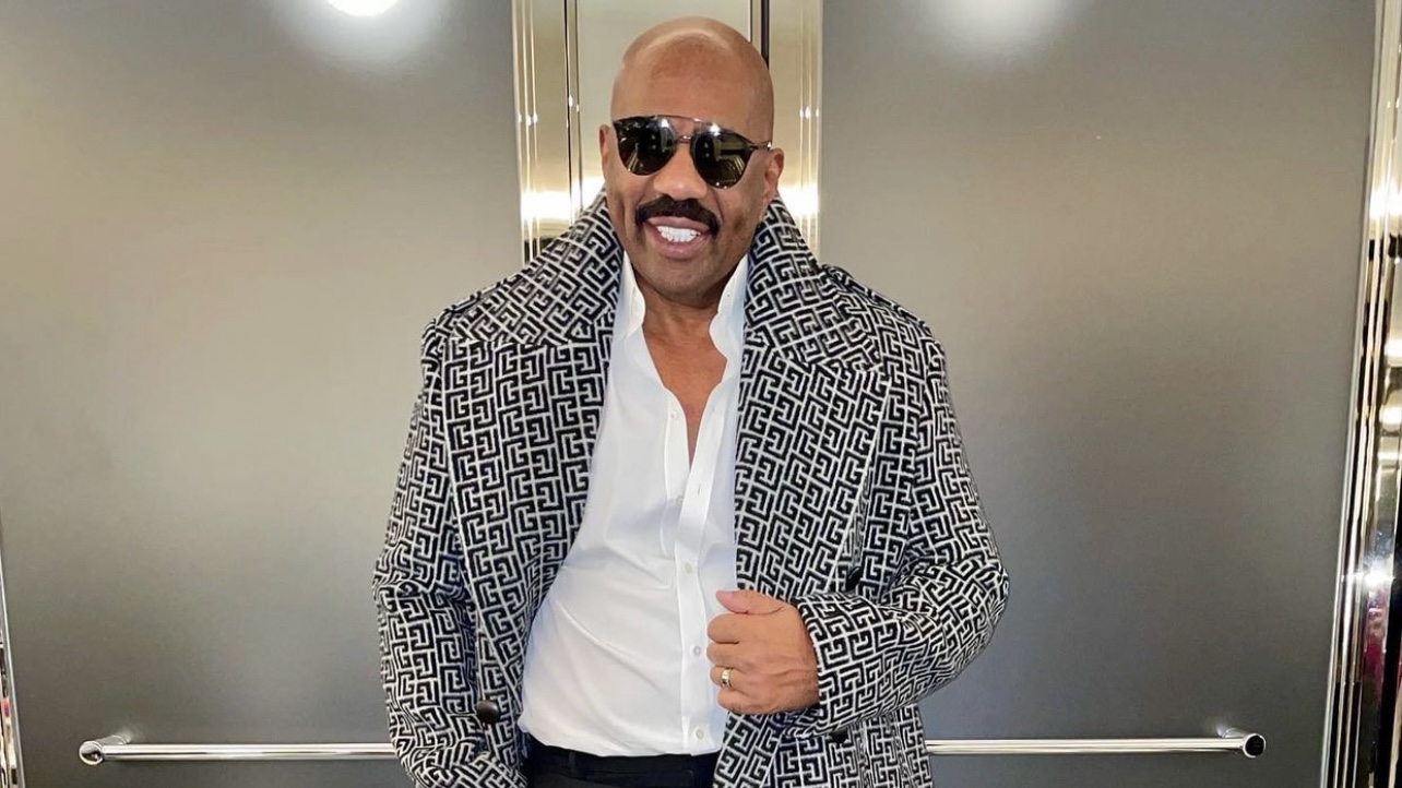 Steve Harvey Steps in Abu Dhabi Styled in a Louis Vuitton x Virgil Abloh  Purple and Green Landscape Jacket and Matching Shirt – Fashion Bomb Daily