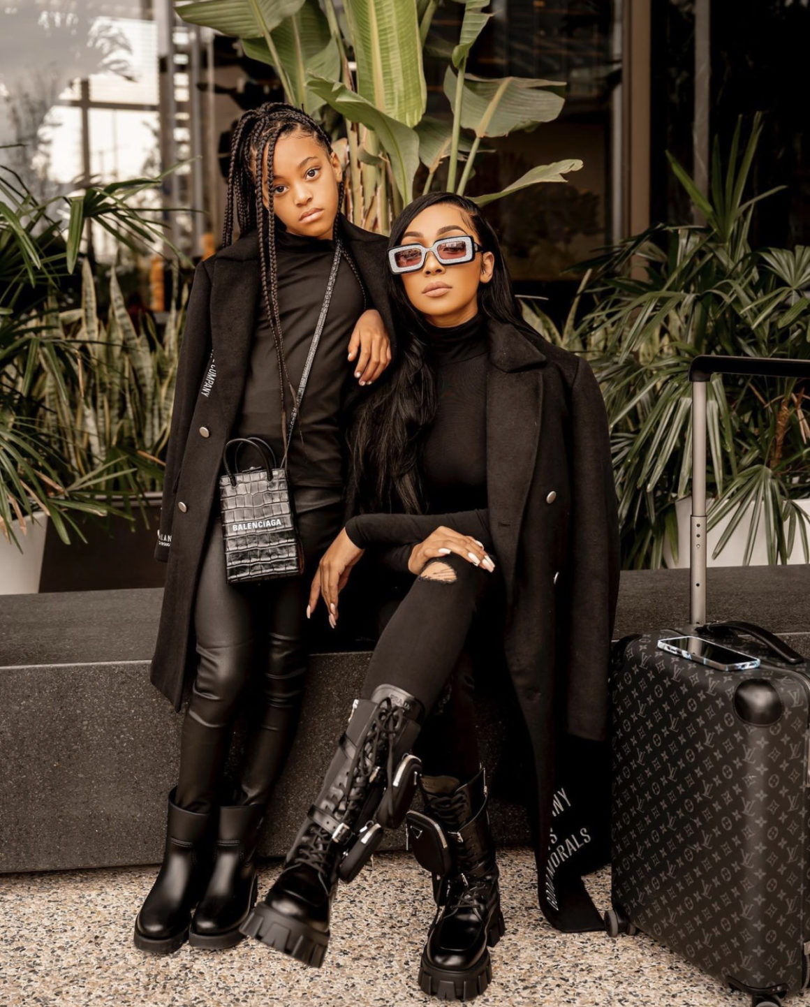 Monica and Daughter Laiyah Get Fly Together in Matching Black Milano Di Rouge Black Trench Coats