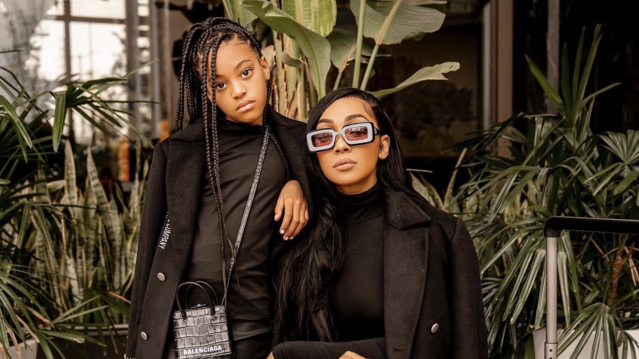 Monica and Daughter Laiyah Get Fly Together in Matching Black Milano Di Rouge Black Trench Coats cover