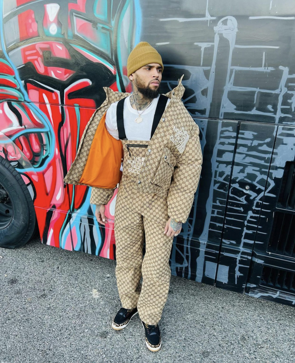 Chris Brown Spotted in Gucci x The North Face Monogram Jacket and Overalls  Paired With Air Jordan 3 Sneakers – Fashion Bomb Daily