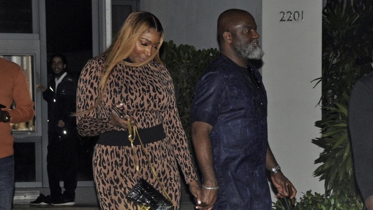 Nene Leakes Steps Out with Nyonisela Sioh Wearing Wolford Leopard Print Top and Leggings Look Paired with Gianvito Rossi Black Satin Ankle Tie Sandals cover
