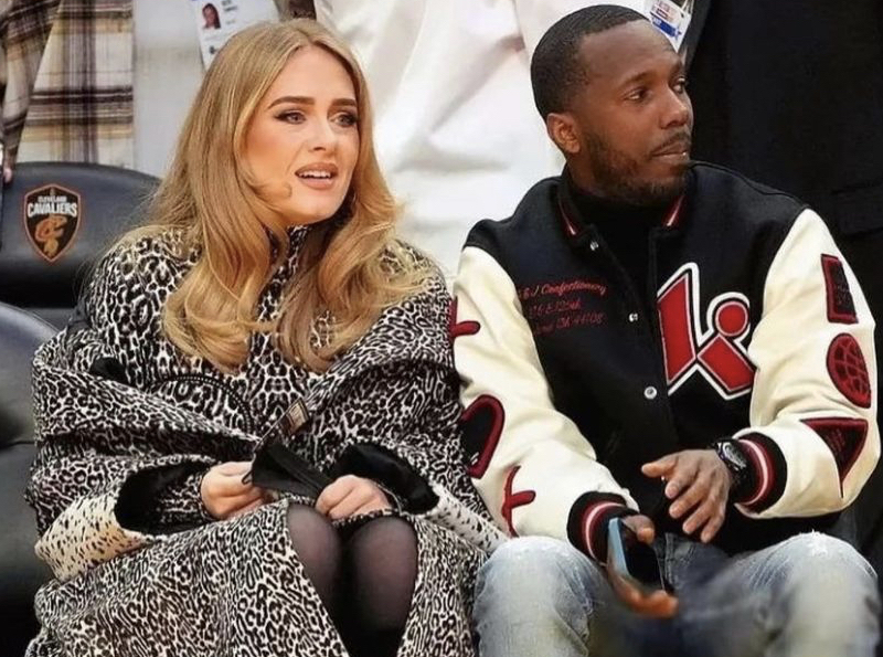 Adele wears Louis Vuitton at an NBA game with boyfriend Rich Paul